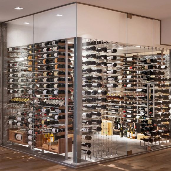 Modern wine cellar with glass walls displaying a large collection of wine bottles.