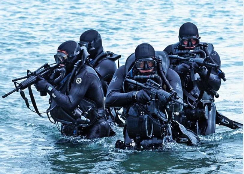 armed navy seals in water