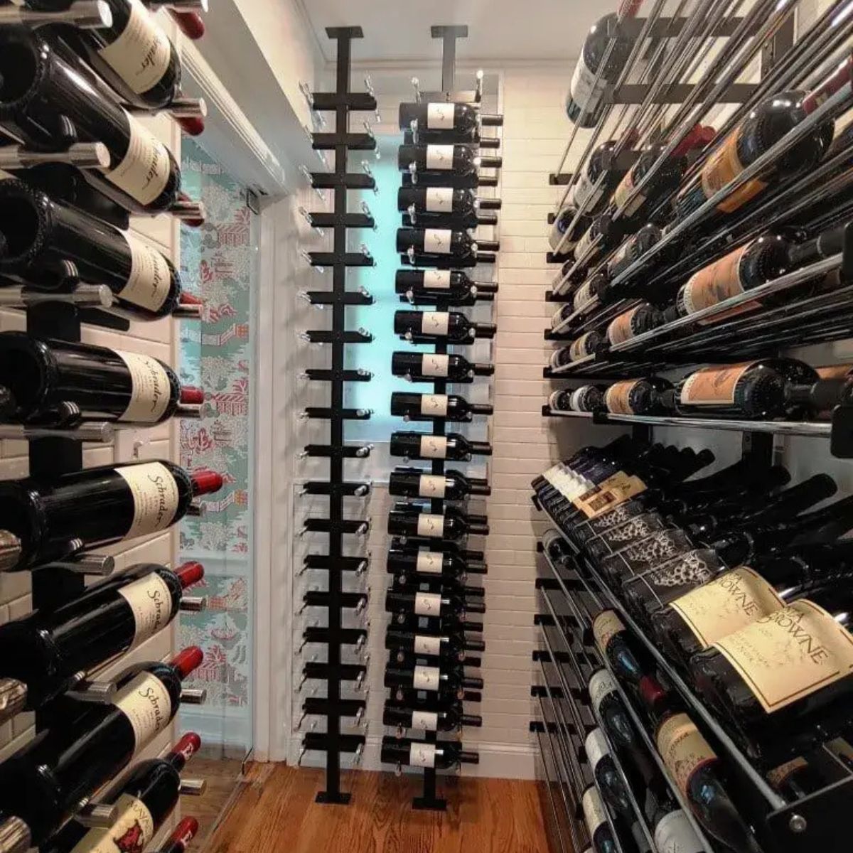 vino post system in narrow wine room with vertical bottle storage on both sides