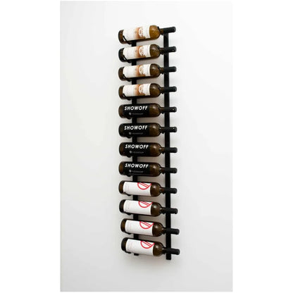 Wall-mounted black wine rack with labeled bottles on a white background