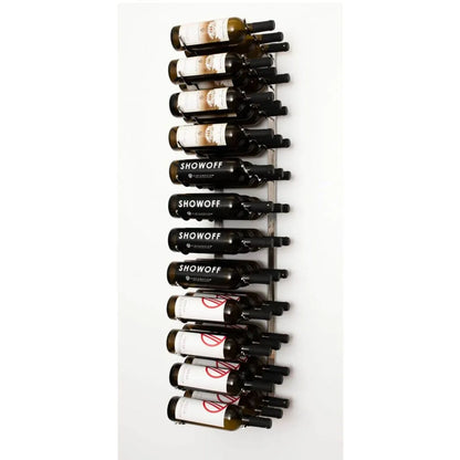 Wall-mounted wine rack with wine bottles on a white background