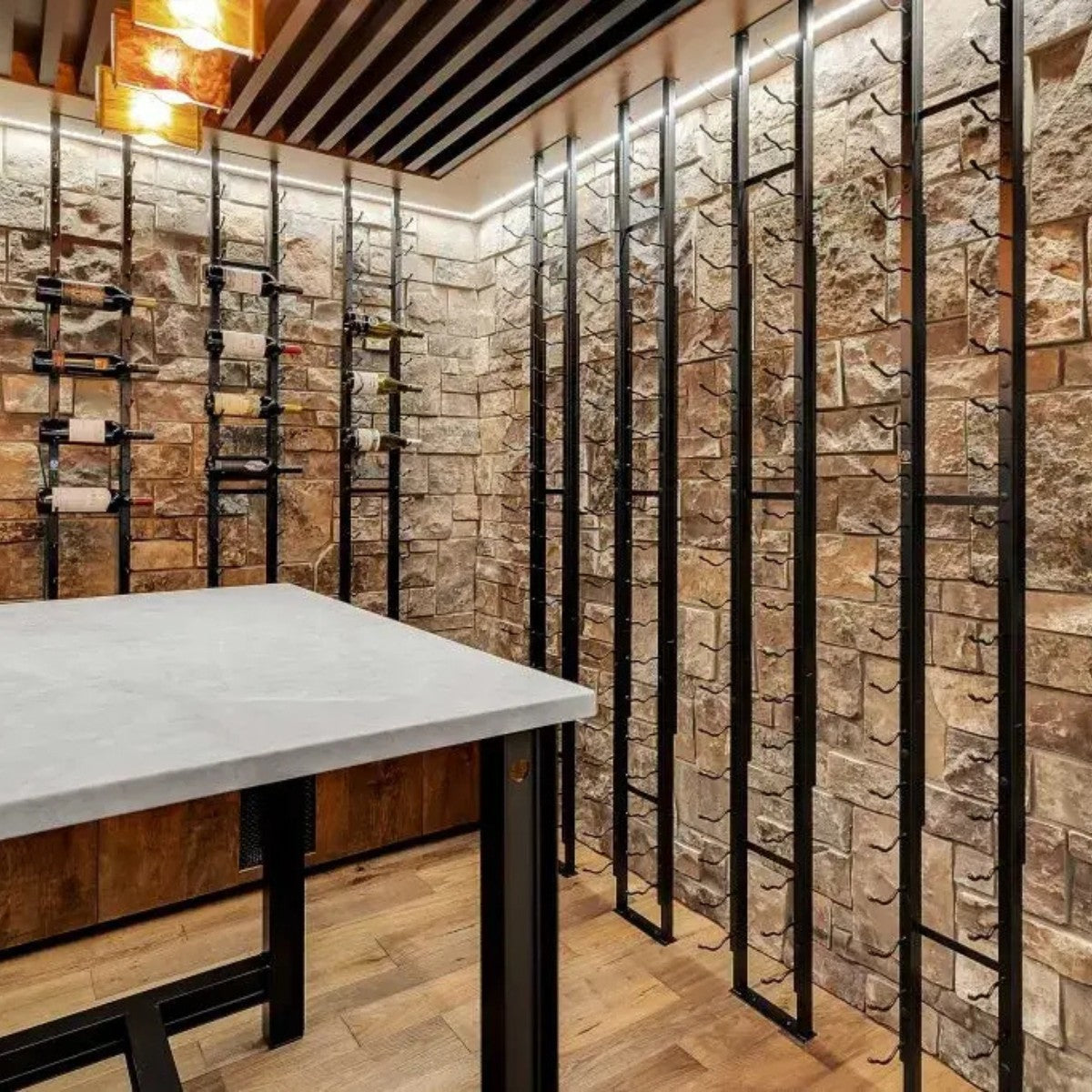 Modern interior design with stone walls, metal shelves, and a concrete table.