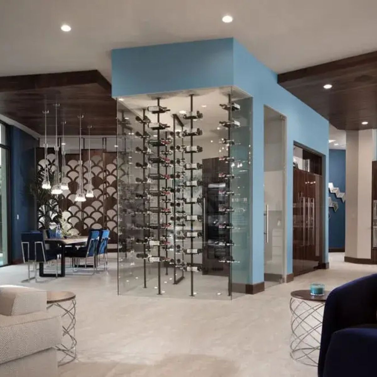 glass enclosed floating wine rack system with floor-to-ceiling post columns in open living space