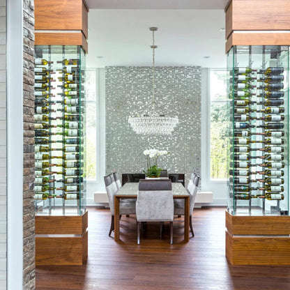 Dining room with wine bottles displayed on glass walls