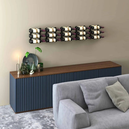 Wine rack mounted on a wall above a blue sideboard with a gray sofa and decorative items.