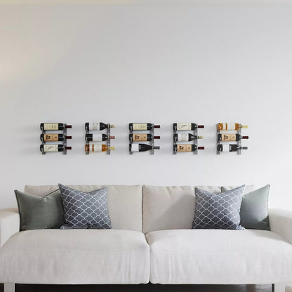 Wine rack mounted on a wall above a sofa with decorative pillows.