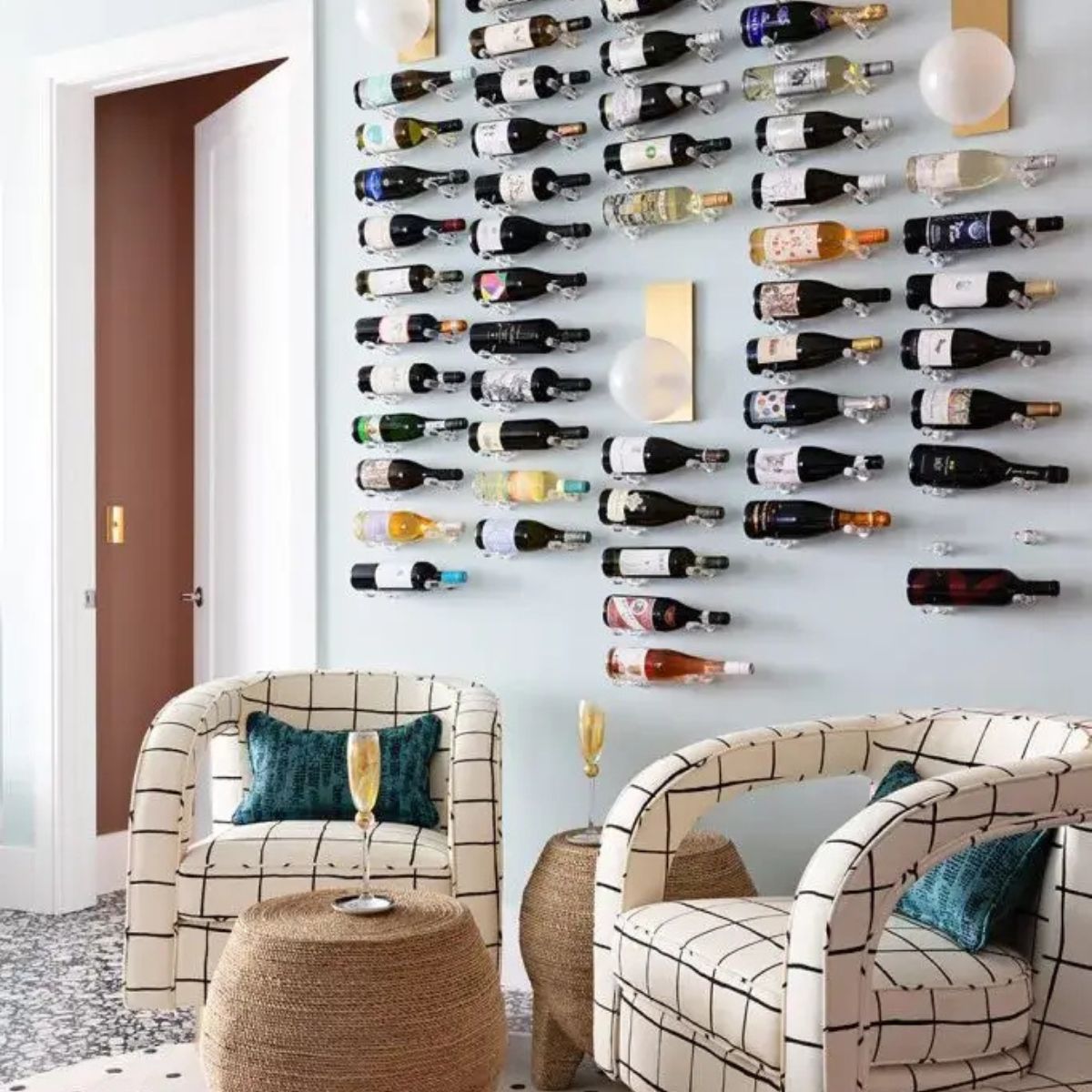 Designer wine feature wall with multiple clear acrylic wine pegs creating a full bottle display