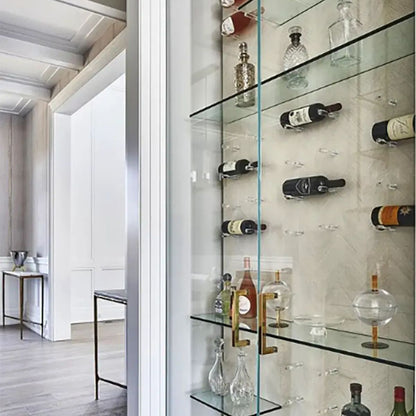 Clear acrylic wine pegs installed inside glass cabinet for floating label-forward wine bottle storage
