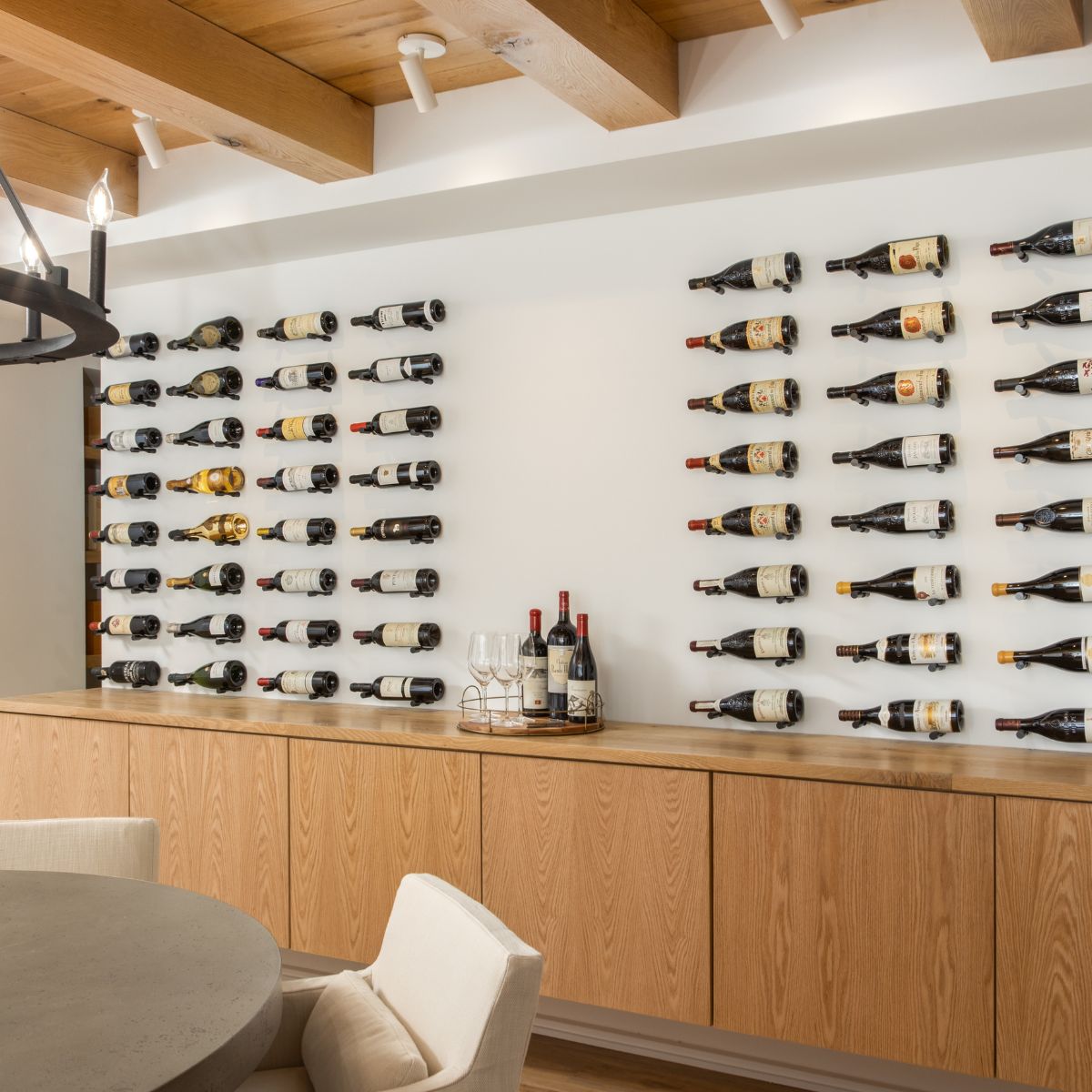 VintageView Vino Pins Mag 1 mounted on a minimalist wall wine display with magnum bottles