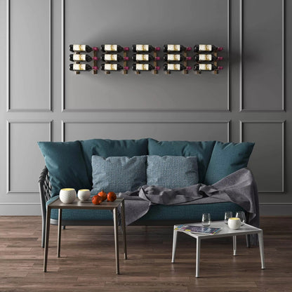 Living room with teal sofa, small table, and wall-mounted wine rack.