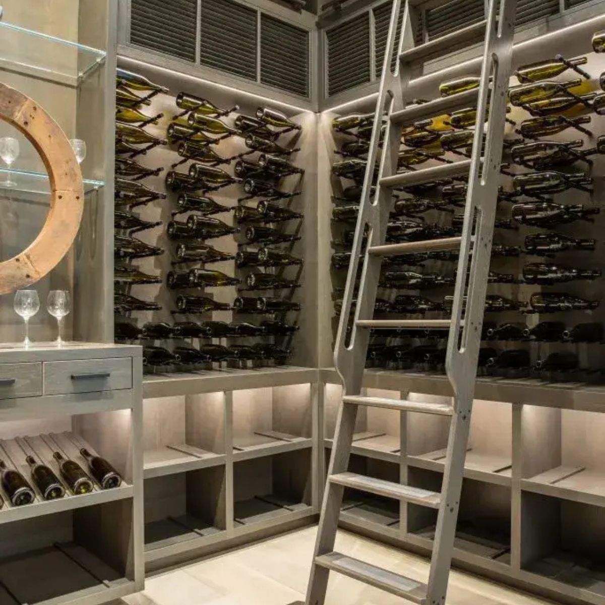Wine cellar with ladder and wine bottles on shelves