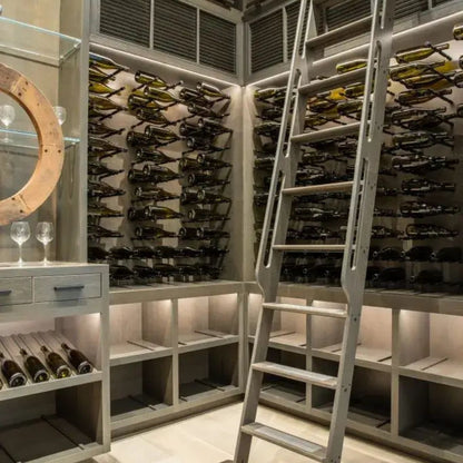 Wine cellar with ladder and wine bottles on shelves